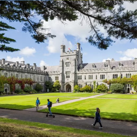 University students walking across campus at University College Cork