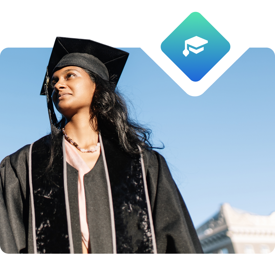 Student in cap and gown looking to the top left and smiling.